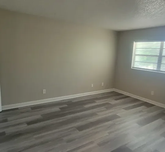 empty room with hardwood floors and a door at The  Element At 464