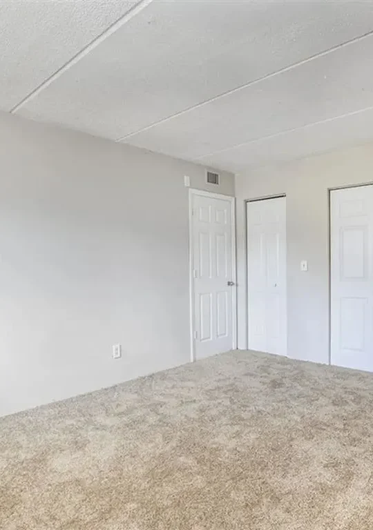 empty room with carpet and white walls at The  Element At 464